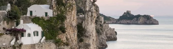 View of the picturesque coastline and cliffs in Amalfi at sunset