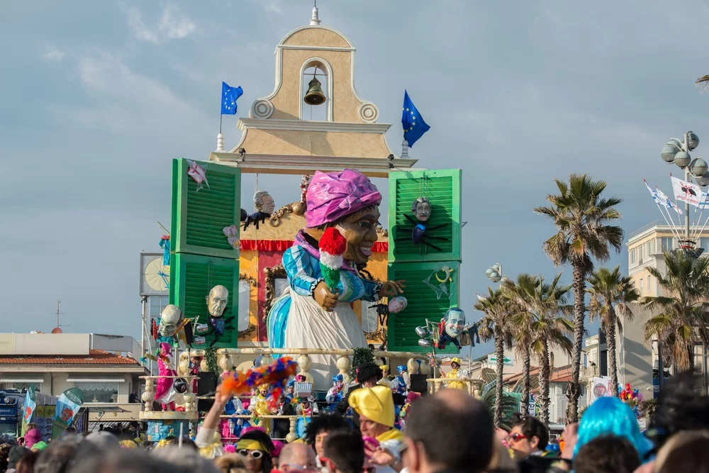 Shows carnival float with giant paper mache figure in Viareggio, Italy