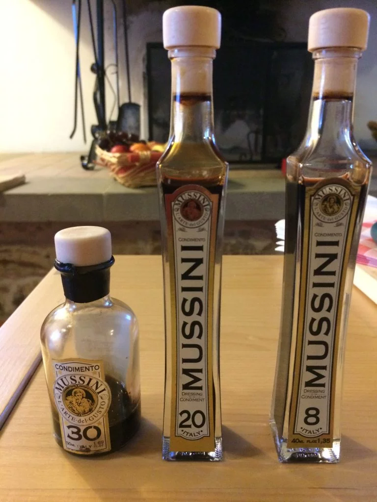 Three different types of balsamic vinegar on a table 