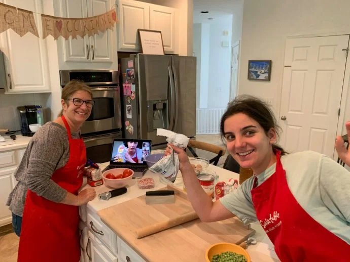 Mother and daughter ready for an online cooking course